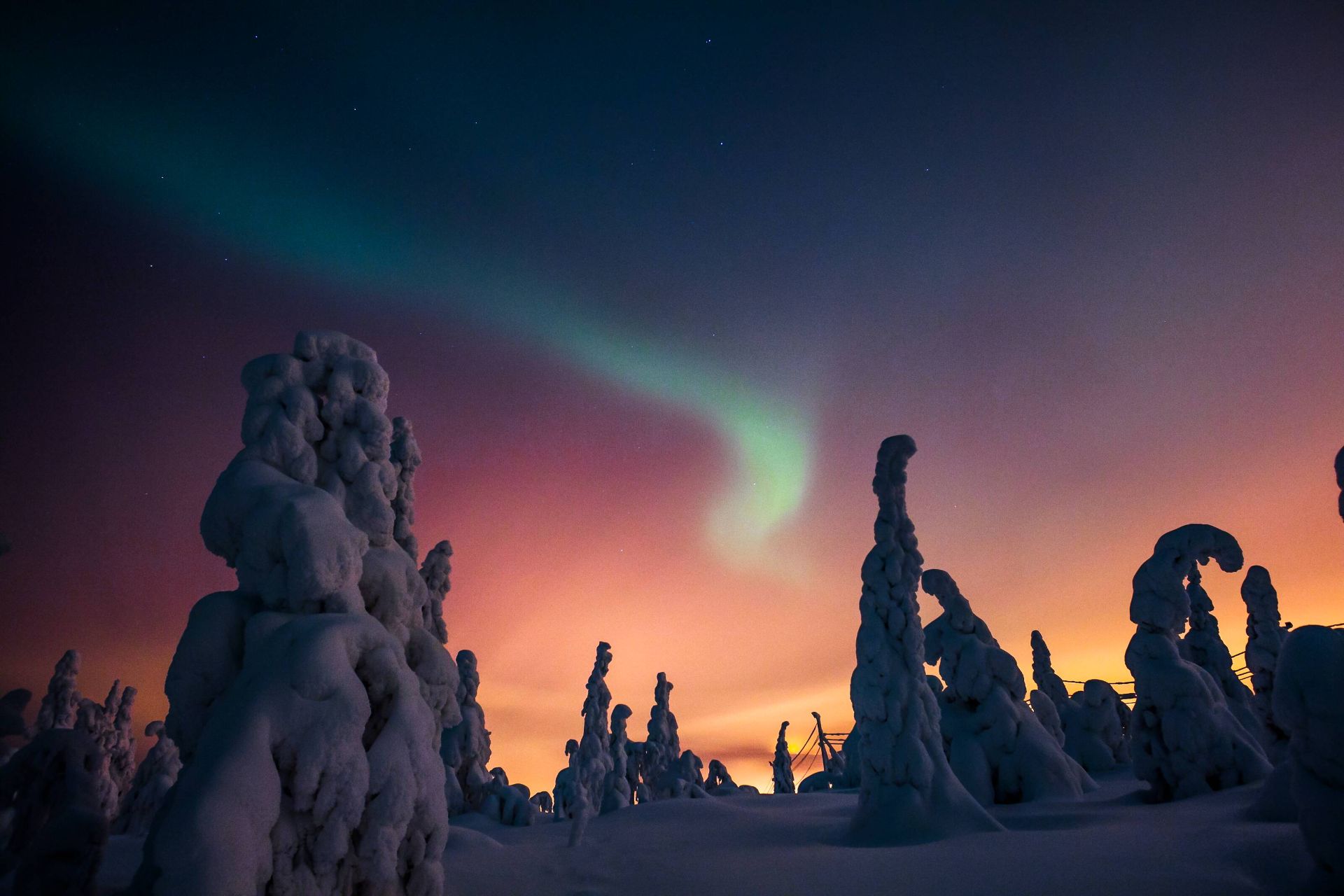 Saariselkä and Finnish Lapland from above igloos under the aurora