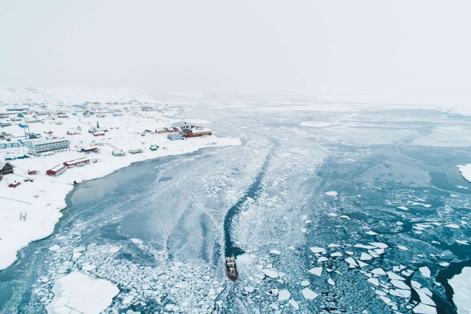 Boat in the frozen sea near Ilulissat, Greenland