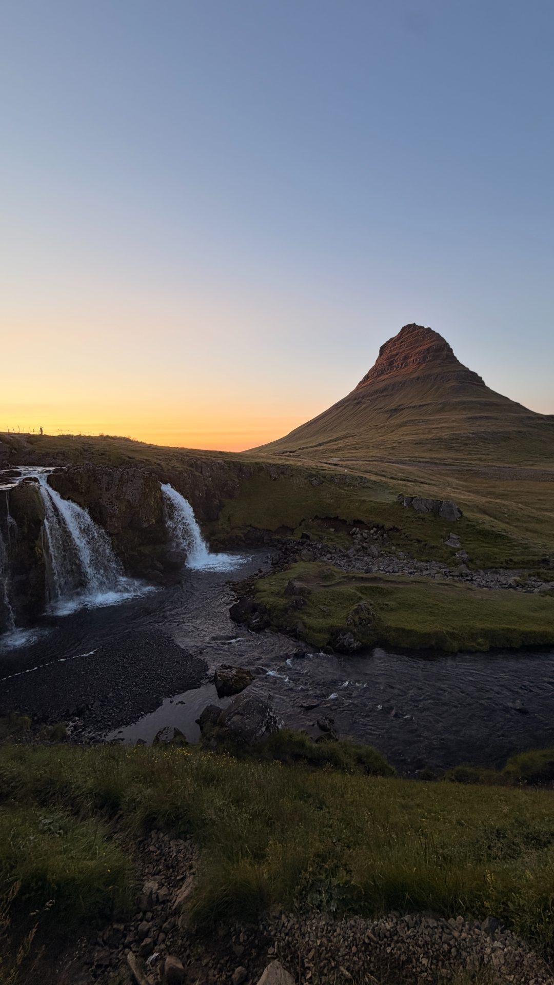 Kirkjufell mountain and the Kirkjufellsfoss falls at sunset, Snæfellsnes, Iceland